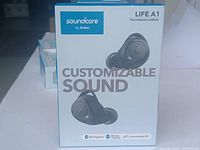 Front view of retail box showing Soundcore Life A1 wireless earbuds, customizable sound, and 35h playtime with charging case.