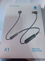 Front of the retail box with image of Nanami X1 wireless headphones and waterproof IPX7 icon