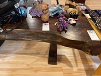 Top view of the slab wood table showing natural bark edges and items on top (not included)