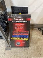 Box showing image and details of Ironton metal rack with storage bins.