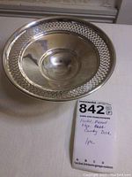 Top view showing the pierced edge pattern and smooth center of the candy dish.