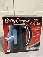 Boxed Betty Crocker cordless electric jug kettle showing front and features