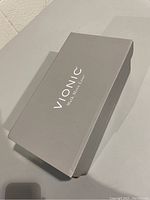Closed grey Vionic shoe box with logo and text 'Vionic Walk. Move. Live.'