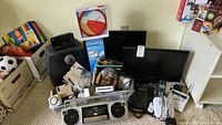 Wide view showing all lot contents arranged on carpet