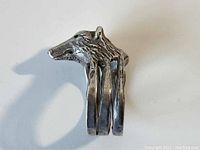 Front view showing the detailed bear's head design and triple band construction of the sterling silver ring.