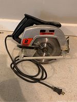Viewed from the right side, showing main body, power cord, user handle, blade guard, and base plate. Shows the 2 horsepower label and Craftsman branding clearly.