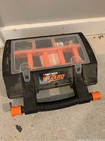 Closed view of the Black & Decker Wizard carrying case showing transparent cover and locking latches