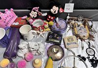 Front angle showing all items in the lot including plush toys, ceramic figurines, decorative items, coasters, and wind chimes.