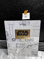 Front view of the sealed Star Wars The Blueprints book showcasing the detailed blueprint design on the cover and title.
