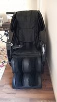 Front view of chair showing seat, backrest and foot massager