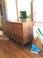 Full view of dresser and attached mirror in room