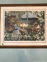 Frontal view of the framed art print depicting floral landscape with flowers in vases, porch and lake background.