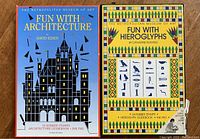 Front view of two stamp kits: Fun with Architecture and Fun with Hieroglyphs, showing packaging design and branding.