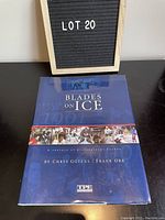 Front cover of 'Blades on Ice' book showing title, authors, and hockey images in blue tone.