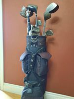 Full view of golf bag filled with clubs showing 948 Tour Series logo, dark blue color, multiple pockets and padded straps.