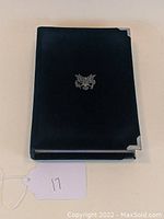 Black velvet case for US Mint 1990 Eisenhower Prestige Proof Set showing front with silver eagle emblem and metal corner accents.