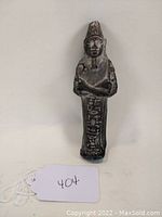 Full front image of the figure with braided beard and distinct headpiece, showing condition and markings.