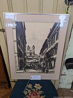Black and white framed print showing street view of Piazza di Spagna, Rome with Trinità dei Monti church in background