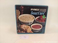 Original product box featuring Pyrex Ware by Corning with colored image of three Horizon Blue pattern mixing bowls containing food.