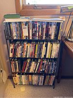 Front view of rack filled with DVDs