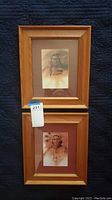 Two framed Native American portrait prints by Robert Garner stacked vertically showing wooden frames and brown mats.