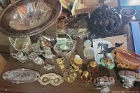 Photo showing the full assortment of miniatures, including EP pedestal dish, salt and pepper shakers, vintage perfume bottles, horse plaque, and other small decorative pieces.