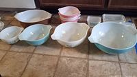 Front view of all mixing bowls and refrigerator dishes