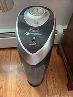 Close-up image of the top and front of one Guardian Technologies air purifier showing controls and branding.