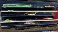 Photo of closed blue Mastercraft tool chest labeled with green tape mentioning screwdrivers in 2 drawers and 1 tray