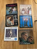 Photo of 6 classical vinyl album covers showing Beethoven, Gershwin, Mozart, Shostakovich, and other composers.