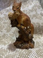 Photo of the front side of the hand painted Ansley Master Craft squirrel figurine showing detailed animal and base stand.