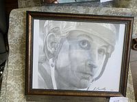 Framed pencil portrait print showing Wayne Gretzky in a hockey helmet, signed by R. Connelly, with visible signature and date on print.