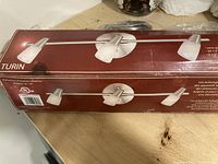 Original boxed Turin 3-light ceiling fixture showing packaging design and product image on box.
