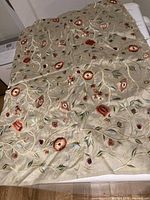 Beige silk fabric piece with detailed embroidered floral designs