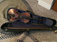 Open case with Hopf violin inside