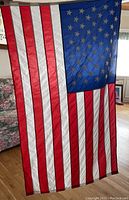 American flag porch flag hanging indoors showing 50 stars and stripes