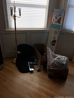 Photo shows the 58in brass floor lamp with multiple bulbs beside a digital bath scale, Homedics back massager box, and other packed items.