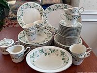 Overview photo showing the full Noritake Atlanta china set including plates, teacups, saucers, serving bowl, platter, creamer, and sugar bowl arranged on a table