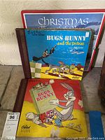 Two Bugs Bunny storyland records with colorful illustrated covers and one Christmas Through the Year record behind them.
