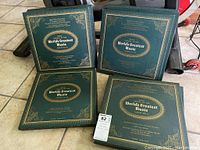 Shows four green LP albums from series with gold text and decoration, labeled Volumes 1 to 4