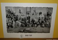 Full view of limited edition print "Road Trip" showing group in western style attire, seating map number visible