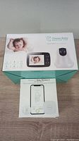 Two boxed baby monitors: Dream Baby Monitor Pro and Sense-U Baby Monitor 2