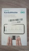 Front of AliveCor KardiaMobile EKG device box showing branding, device image, and specifications.