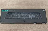 Front view of Logitech MX Keys Advanced Wireless Illuminated Keyboard in factory packaging