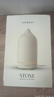 Box of Vitruvi Stone essential oil diffuser showing the product image and branding on front.