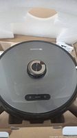 Top view of robot vacuum in foam packaging