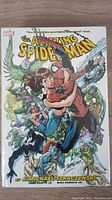 Front cover showing Spider-Man holding Mary Jane with various Spider-Man villains and characters in background