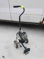 Full view of the Wagner 505 airless paint sprayer mounted on a two-wheeled cart with handle. Missing spray hose and spray gun attachments. Black motor housing with cables visible.