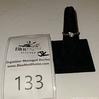 Silpada Belle Fleur sterling silver ring displayed on black ring holder with auction lot tag 133.