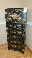Front view showing full chest with hinged top cabinet and four drawers
